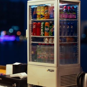 sodas and water in a fridge