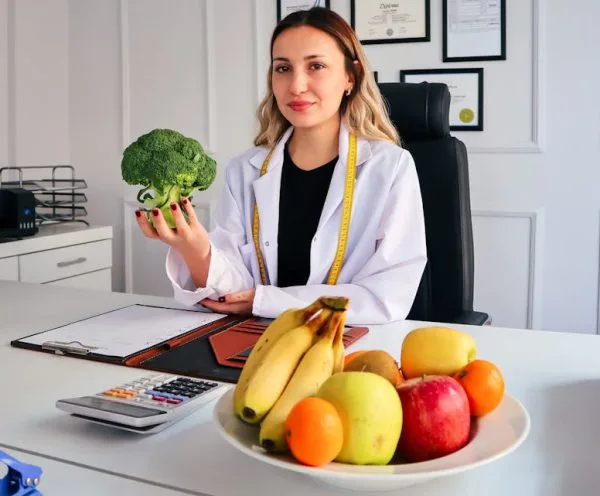 woman holding a brocolli